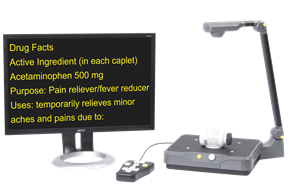Eye-Pal Vision scanning and reading appliance showing magnified pill bottle instructions on a monitor. Eye-Pal Vision scanning and reading appliance showing magnified pill bottle instructions on a monitor.